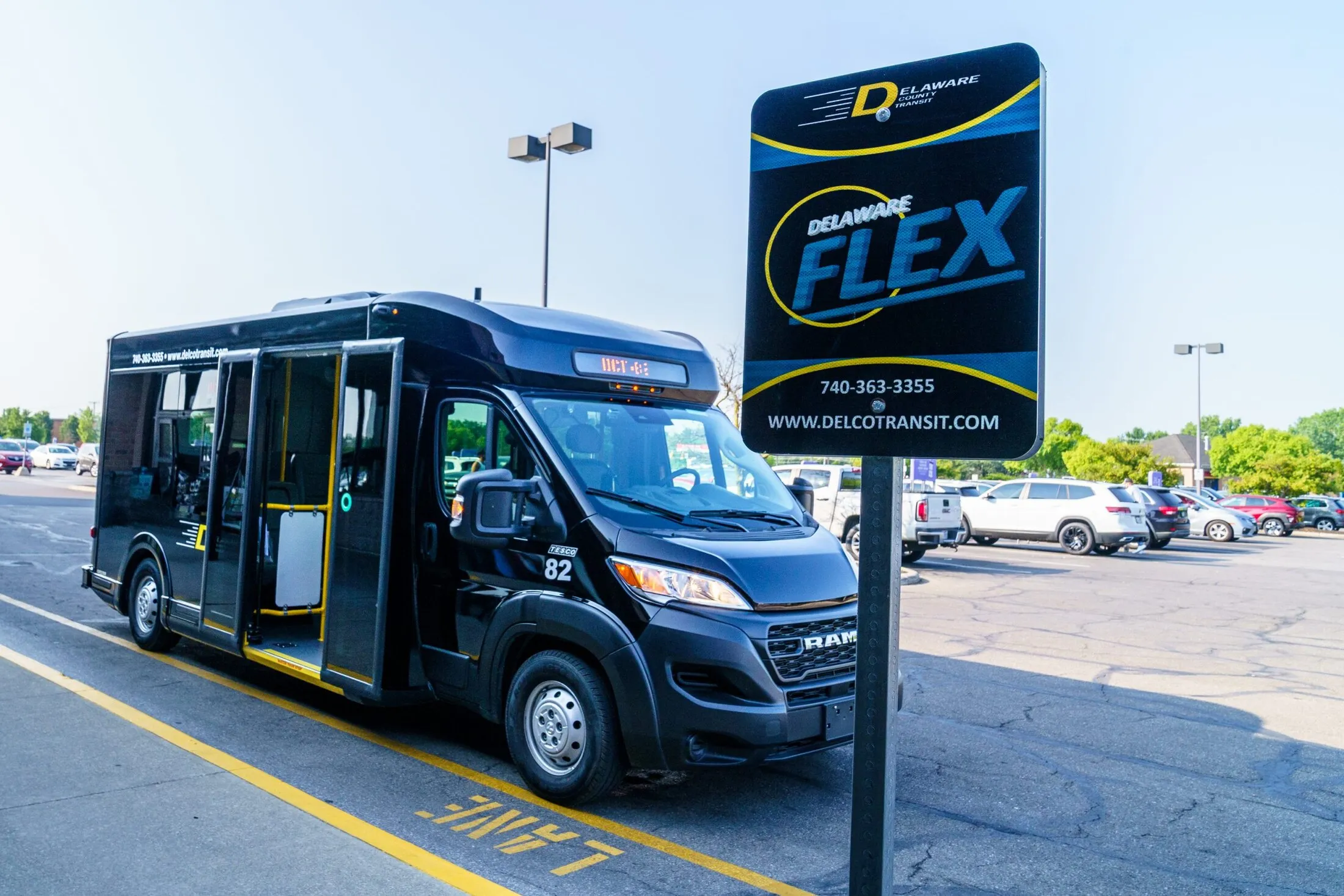 A FLEX van parked beside the Delaware FLEX stop sign