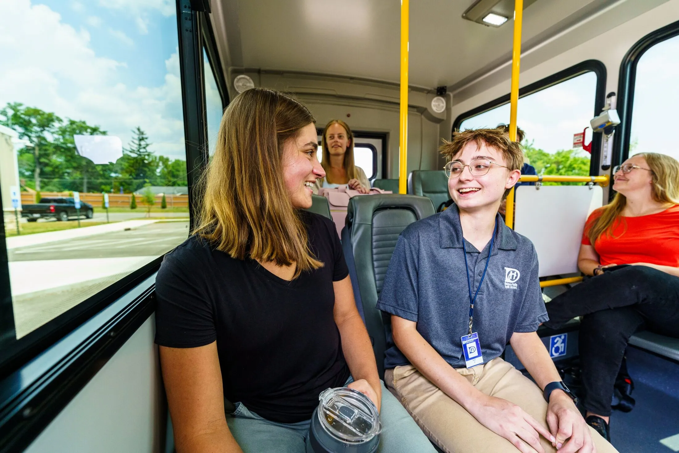 Young riders talking on board a DCT vehicle